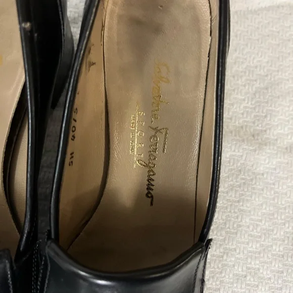 Salvatore Ferragamo Black Loafer Flats with silver logo hardware. Corpcore